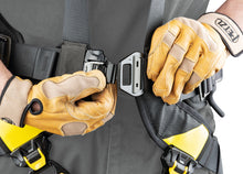 Load image into Gallery viewer, Person putting a harness on