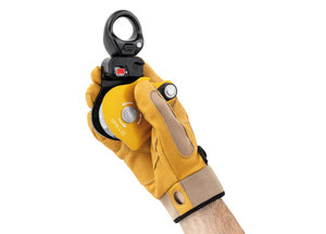 gloved hand holding Petzl Spin L1D pulley with one-way rotation and swivel with open gate Width="1200" Height="861"