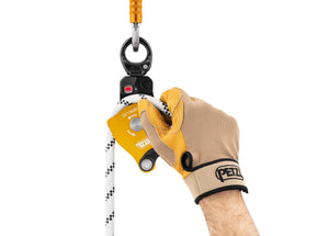 gloved hand placing rope through Petzl Spin L1D pulley with one-way rotation and swivel Width="1200" Height="861"