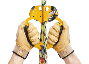 Two gloved hands operating Petzl Ascentree double handed ascneder on green, white and black rope Width= "1200" Height= "861"