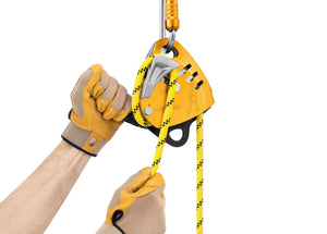 gloved hands operating Petzl maestro S small descent control/belay device attached to carabiner Width="1200" Height="861"